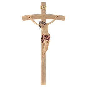 Crucifix Christ with red vest on courved cross