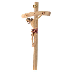Crucifix Christ with red vest on courved cross