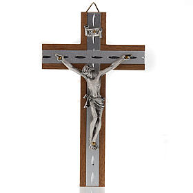 Kruzifix aus Aluminium und Nussbaumholz.