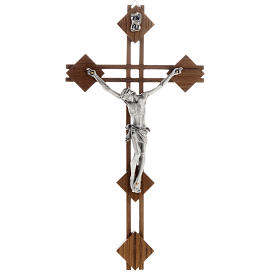 Stilisierter Kruzifix aus Nussbaumholz und Metall.
