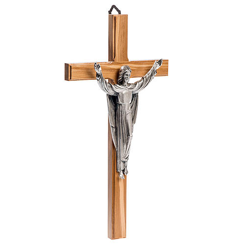 Cruz estilizada de caoba, cuerpo de Jesús plateado 3