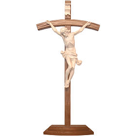 Curved crucifix with base, natural wax Valgardena wood