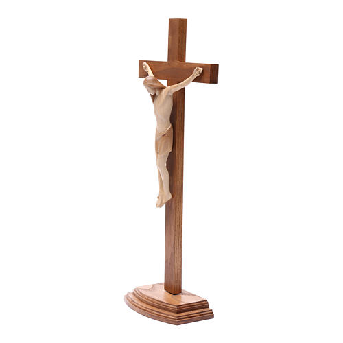 Krucyfiks stylizowany z podstawką drewnianą Valgardena patynowany. 2