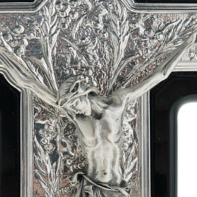 Silver Crucifix on Black Wood