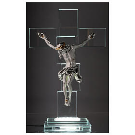 Crucifix in crystal with body in metal and light