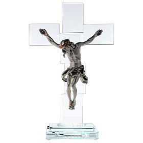 Modern crystal crucifix with metal body of Christ and light