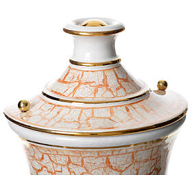 Cremation urn in ceramic, gold white