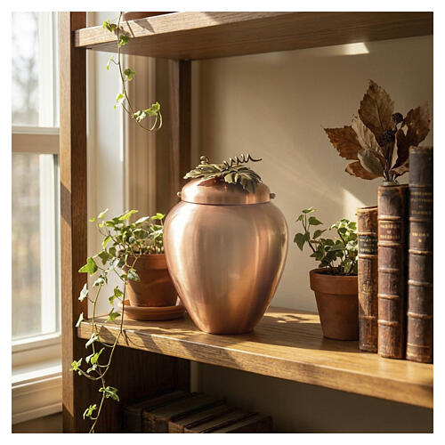 Cinerary urn in copper with decorative vine motif, 10 in 2