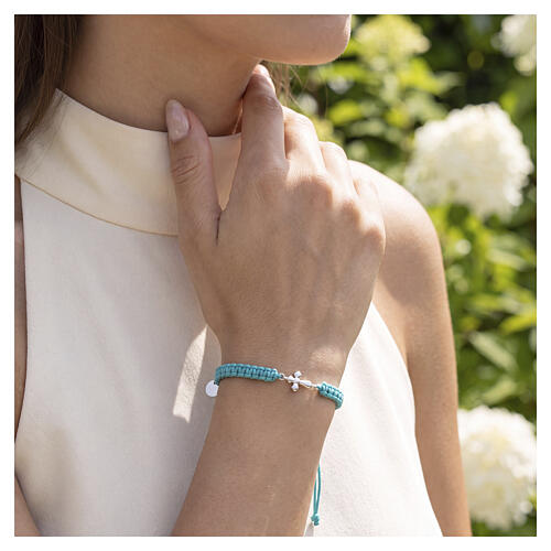 Pulsera Benedictus de tejido tuquesa y cruz rodiada 2