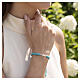 Bracciale Benedictus in tessuto turchese e croce rodiata s2
