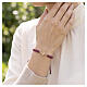 Pulsera de tejido violeta y cruz rosada Benedictus s2