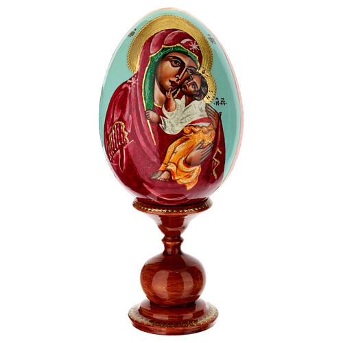 Painted wooden egg on light blue background, Mother of God of Yaroslavl, 10 in 1