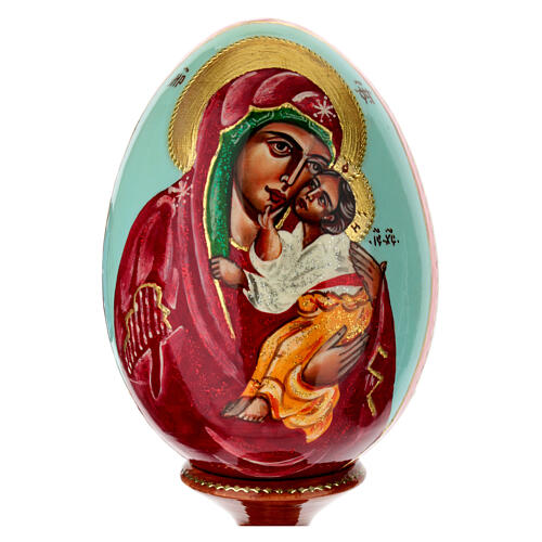 Painted wooden egg on light blue background, Mother of God of Yaroslavl, 10 in 2