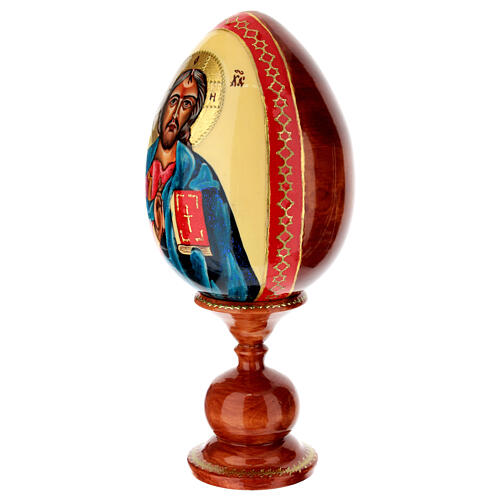 Hand-painted egg with Christ Pantocrator icon on ivory-coloured background, 10 in 3
