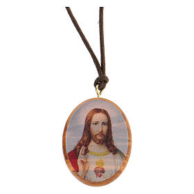 Ovale Medaille aus Olivenbaumholz mit dem Heiligsten Herzen Jesu