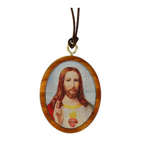 Ovale Medaille aus Olivenbaumholz mit dem Heiligsten Herzen Jesu