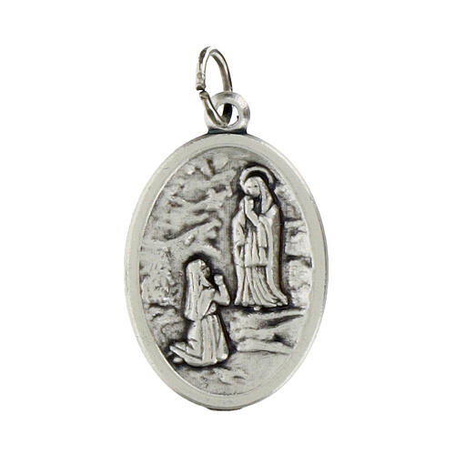 Our Lady of Lourdes oval medal in oxidised metal 20mm 1