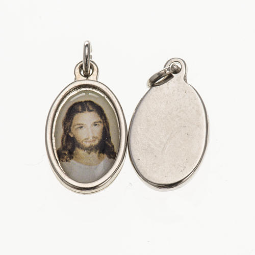 Medalla rostro de Cristo metal plateado resina 1,5x1cm 1