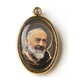 Golden medal with resin image of Saint Pio in resin