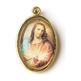 Medalha dourada com imagem Sagrado Coração de Jesus resina