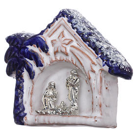 Magnet snowy hut with blue palm tree and Nativity Scene in Deruta terracotta