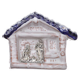 Magnet aus Terrakotta von Deruta mit einer kleinen Hűtte mit blauem Dach und Christi Geburt