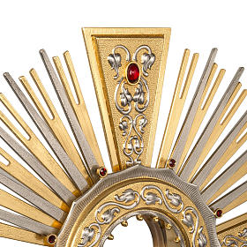 Monstrance in brass with figurines in bronze, with red stones