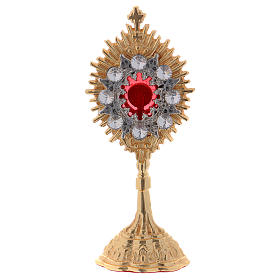 Reliquary in golden brass with white decorative gemstones, h. 14 cm