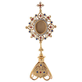 Gold plated brass reliquary with coloured stones and triangular base 25 cm