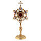 Flower shape reliquary in gold plated brass with colored stones s1
