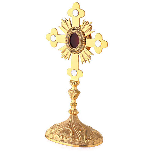 Oval reliquary with budded cross and rays gold plated brass 11 in 4