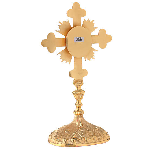 Oval reliquary with budded cross and rays gold plated brass 11 in 6