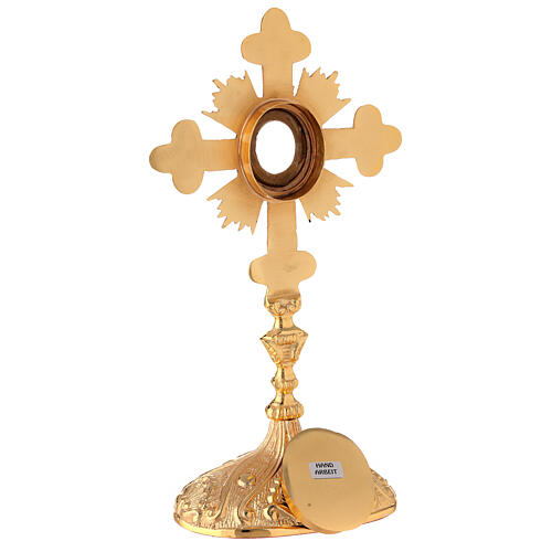 Oval reliquary with budded cross and rays gold plated brass 11 in 7