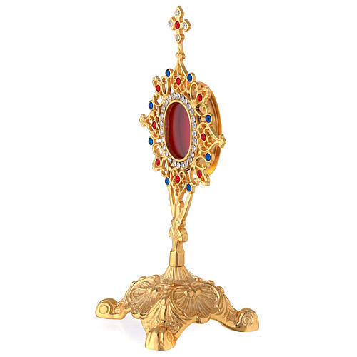 Oval baroque reliquary of brass and crystals 9 1/2 in 4