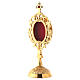 Reliquary with circular base, h 18 cm, gold plated brass s2