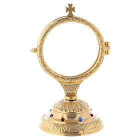 Golden monstrance with decorative stones on the base, h. 15 cm