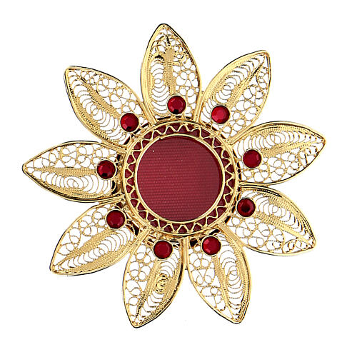 Flower-shaped reliquary 5 cm gold plated silver and red stones 1