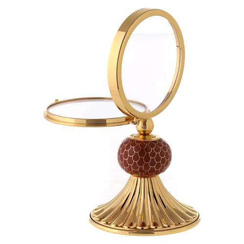 Brass monstrance with red enamelled node, 6 in 4