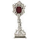 Silver-plated brass reliquary with floral pattern and silhouettes, h 9 in s1