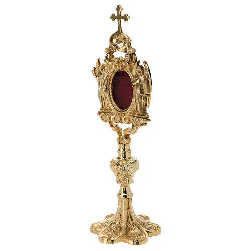 Baroque reliquary of gold plated brass, h 12 in, angels 4