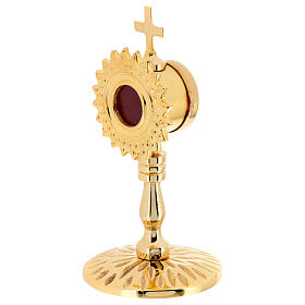 Gold plated brass reliquary of h 5 in, inner diameter of 1.2 in