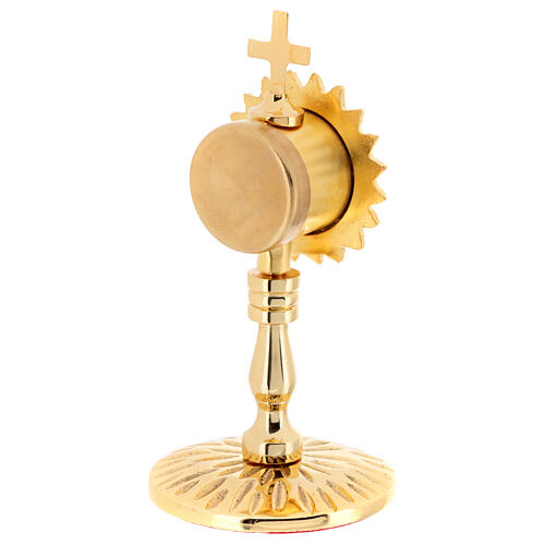 Gold plated brass reliquary of h 5 in, inner diameter of 1.2 in 4