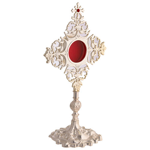 Reliquary of silver-plated brass, decorated rays and cross with red rhinestone, 12 in 4