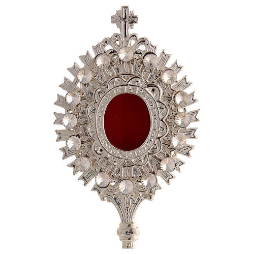 Silver-plated brass reliquary with white stones and radiant design, h 8 in 2