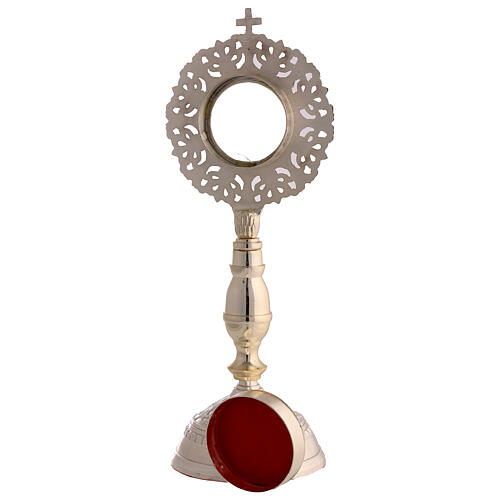 Silver-plated brass reliquary with cut-out intertwined frame, 11 in 6