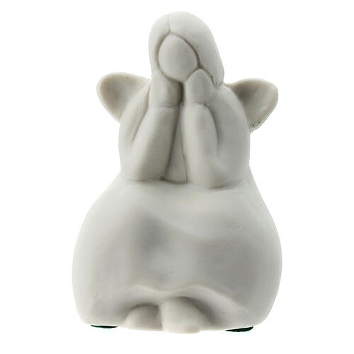 Seated angel 2 1/4 in white porcelain 1