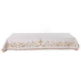 White altar cloth with golden cross, golden and silver flowers