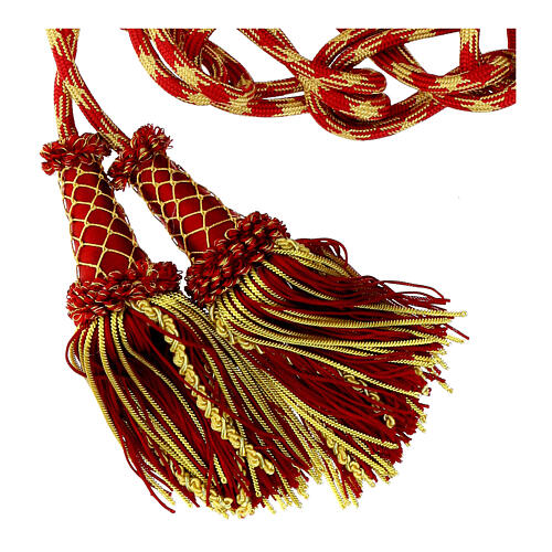 White-and-red sash with a bow, gold tassels