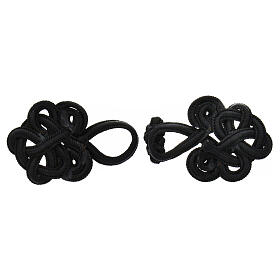 Decorative toggles of black rayon, trimmings