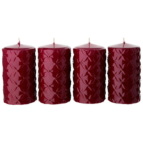 Set of 4 lacquered red candles with geometric decoration, 5x3 in 1